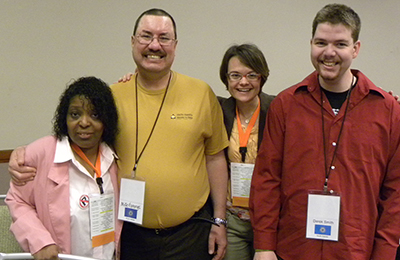 Group photo of Self-Advocacy Summit participants smiling at the camera.
